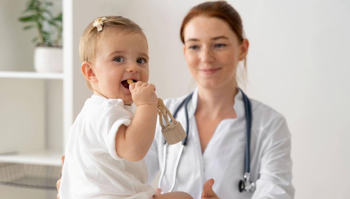 front-view-doctor-holding-baby.jpg